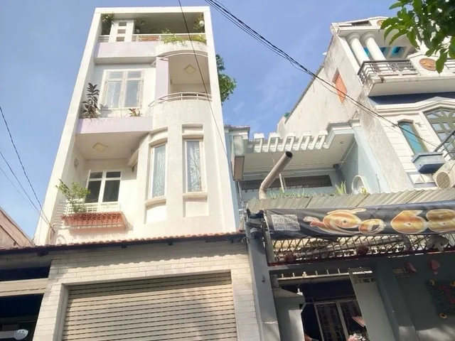 Nhà quang trung, 4 tầng, sổ hồng riêng, xe hơi ngủ nhà, hoàn coing đủ.